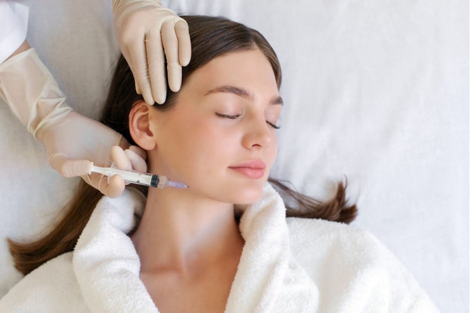 A person getting her face rejuvenated.